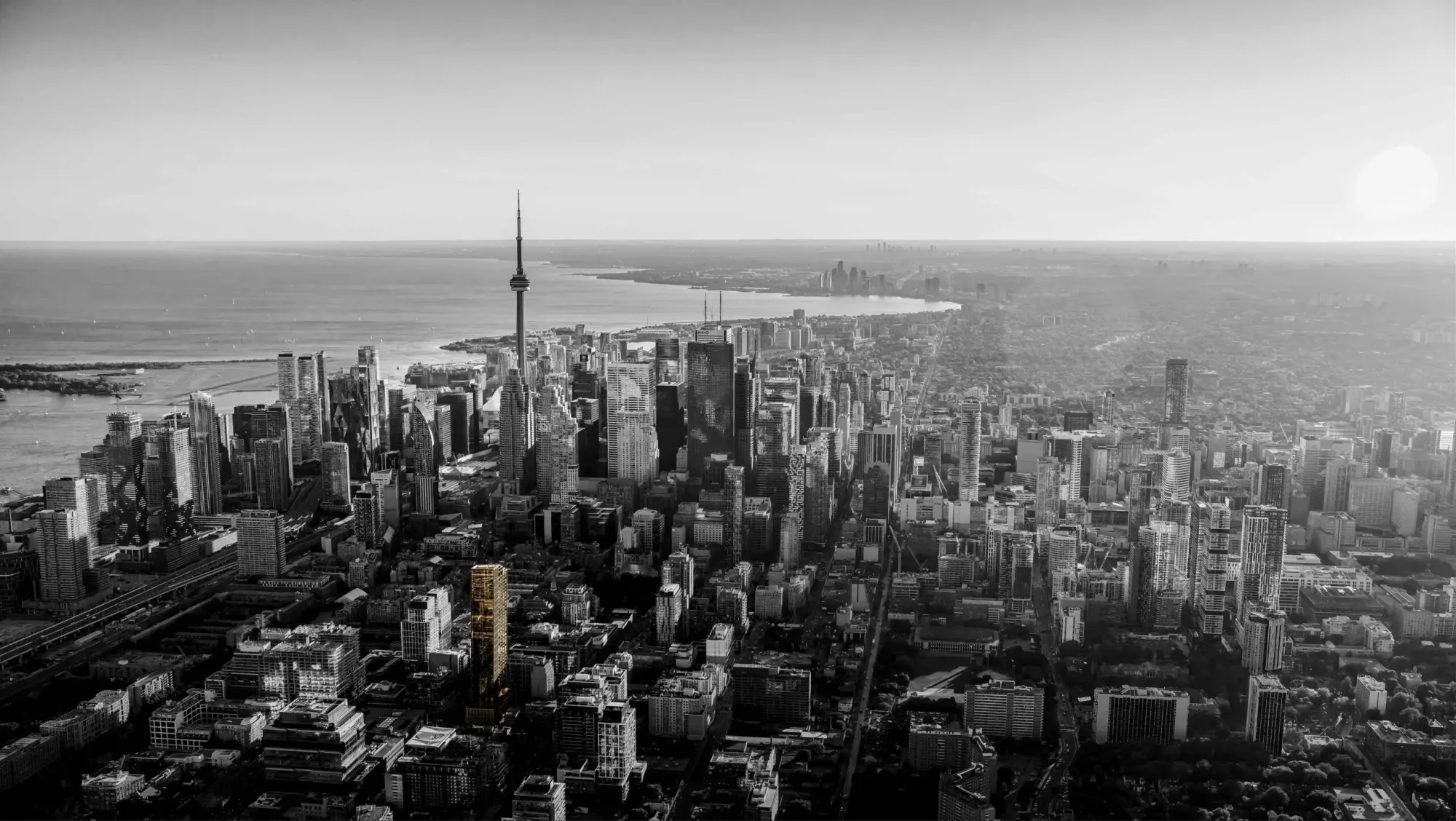 Aerial view of downtown Toronto and the CN Tower with Lake Ontario beyond